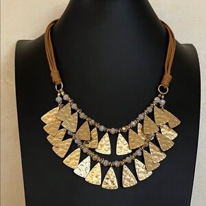 Cleopatra style necklace hammered gold tone pieces and crystal beads on tan cord